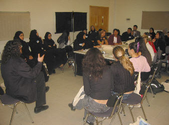 david speaking table David Berman speaking around a table in Qatar